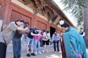 Guests on the “Discovering Shanxi’s Ancient Chinese Architecture” tour practice the Tang-style hand-over-chest salute at Foguang Temple in Xinzhou.