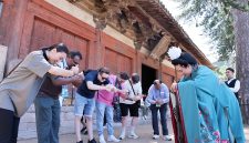 Guests on the “Discovering Shanxi’s Ancient Chinese Architecture” tour practice the Tang-style hand-over-chest salute at Foguang Temple in Xinzhou.