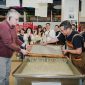 H.E. Mr. Karlis Eihenbaums，ambassador of Latvia to China, tries his hand at the traditional craft of Xuan papermaking.